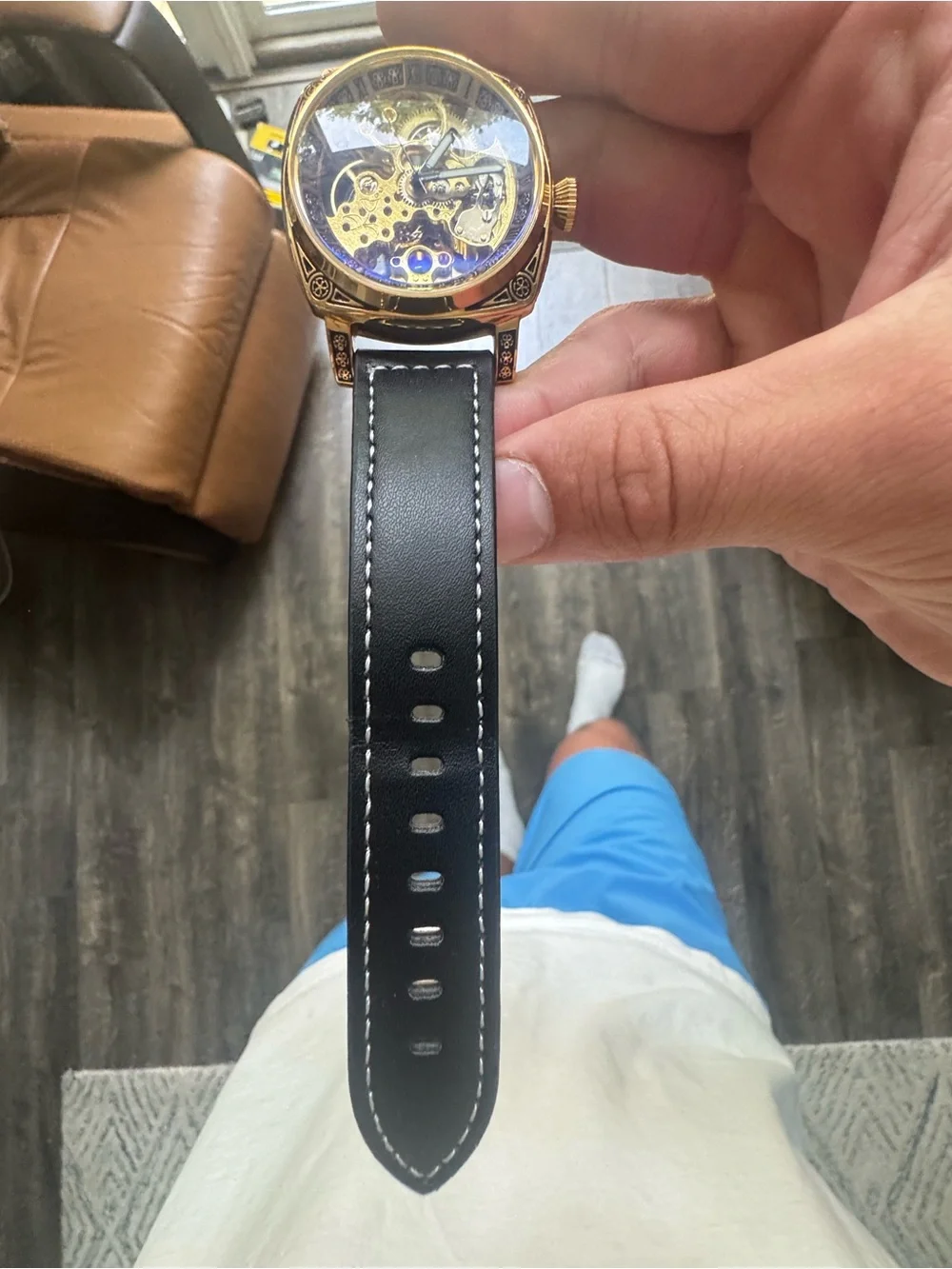 Gold Skeleton Mechanical Watch with Black Leather Strap
